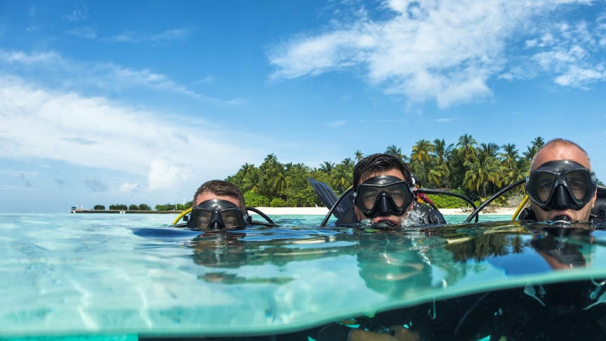 Scuba divers at Awera Resort in the Mentawais Three scuba divers finishing a private and relaxing dive at Awera Resort in the Mentawai Islands