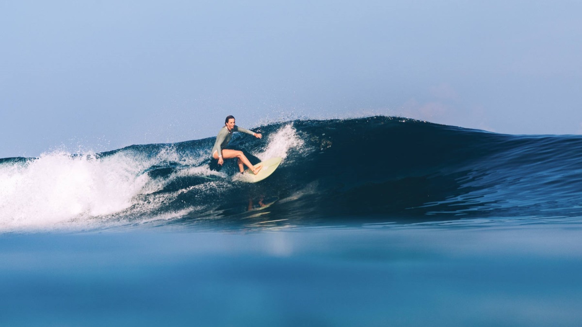 Easy waves for beginners, challenging waves for experts, and everything in between at the Mentawais Surfer girl, guest of Awera Resort, surfing the famous waves of the Mentawais