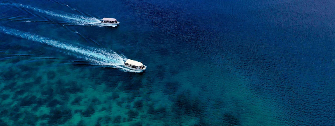 Speedboats of Alami Alor Resort on Kalabahi Bay
