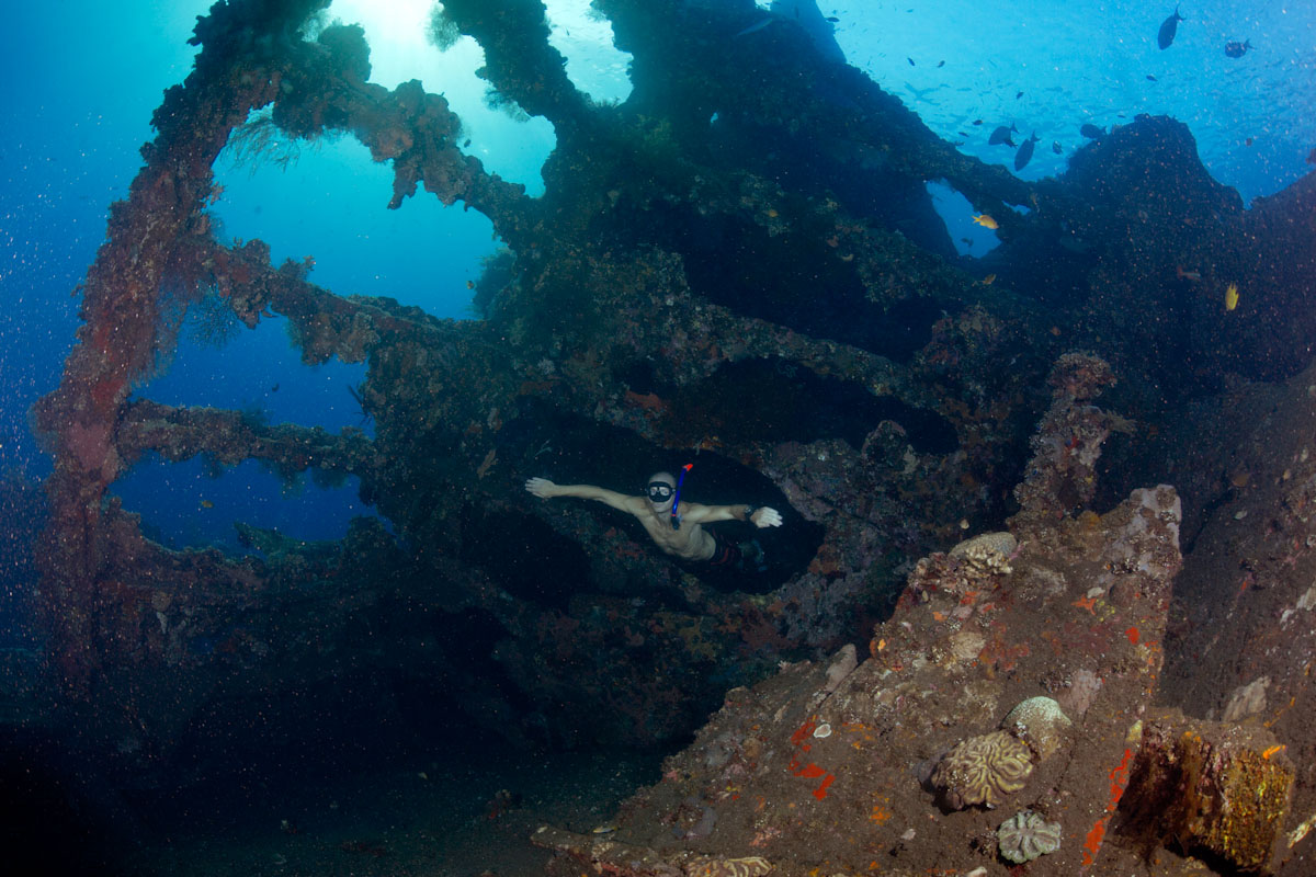 Diver in USAT Liberty shipwreck in Tulamben, Bali