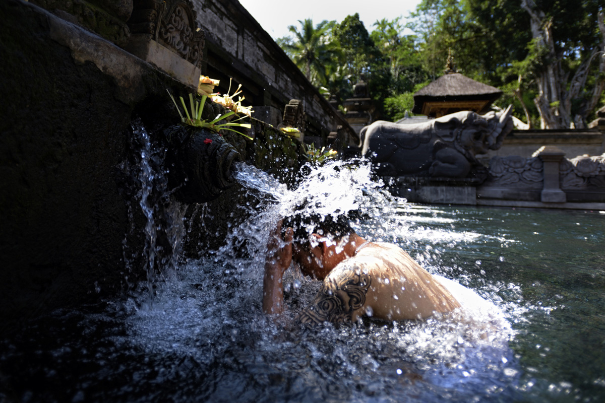 Balinese purification ritual in the water