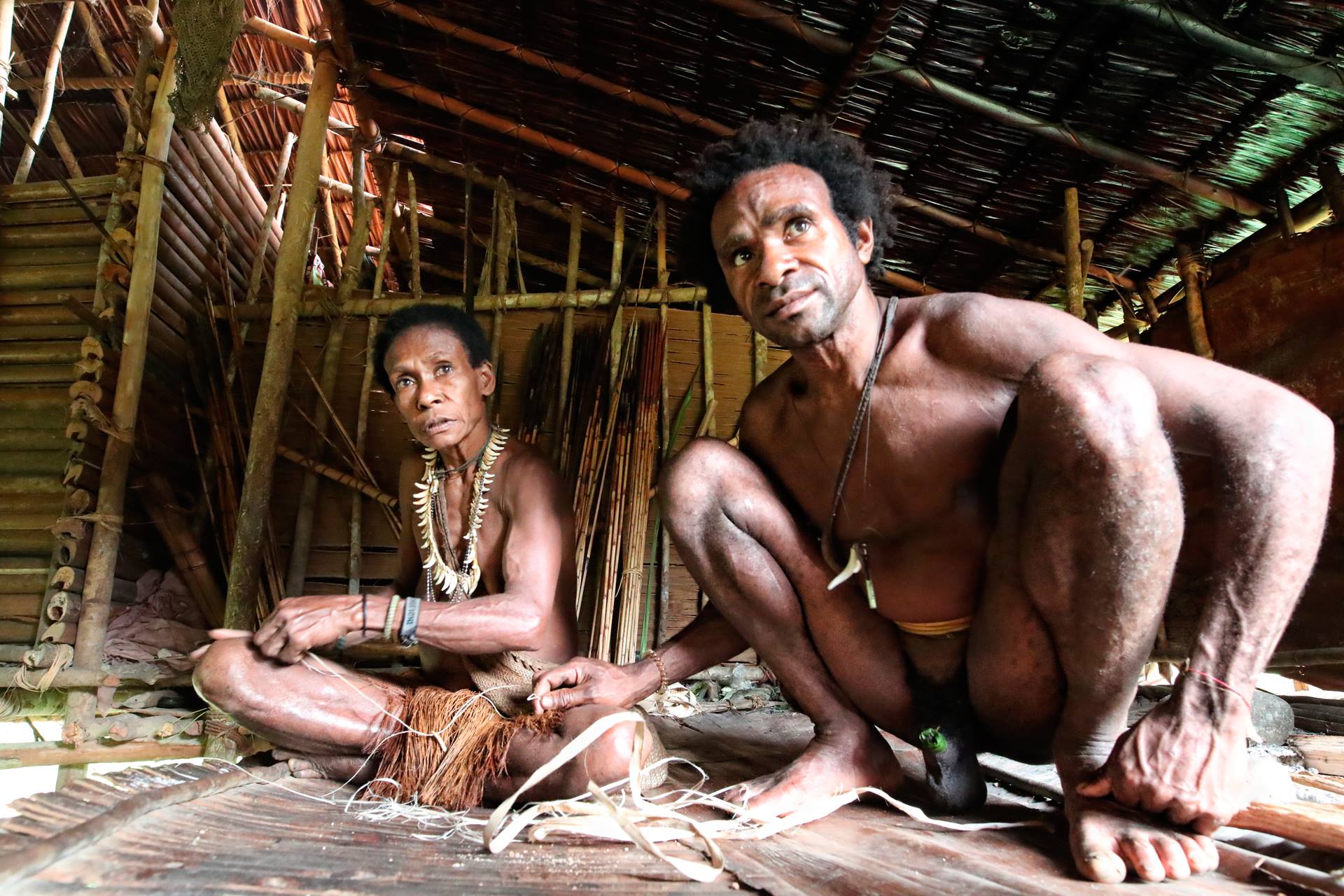 Korowai couple in a hut