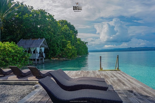 Private terrace with access to the beach at Kri Eco Resort's cottage