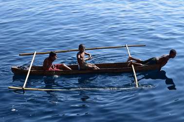Some villagers of Forgotten Islands arriving with their canoes to greet us and browse. Forgotten_Islands_Cruising_Indonesia