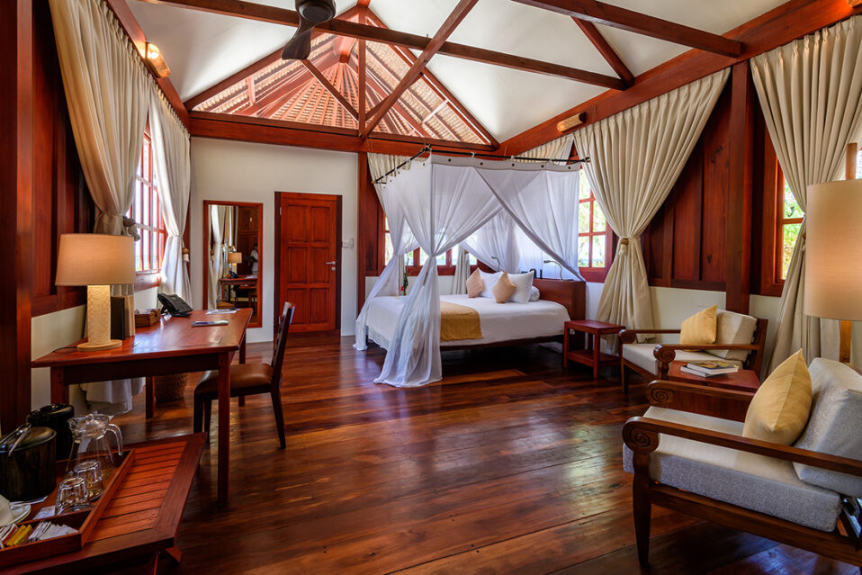 Ocean Bungalow bedroom at Wakatobi Dive Resort
