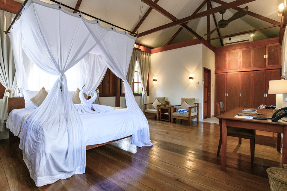 Turtle Beach Bungalow bedroom at Wakatobi Dive Resort

